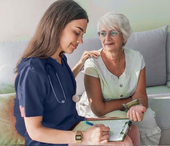 Registered nurse in navy scrubs reviewing a care plan with an older woman at home